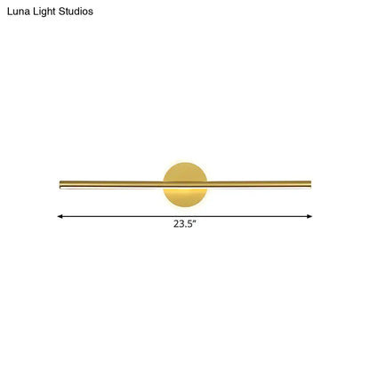 Gold linear wall sconce with circular backplate and slim horizontal bar Luna Light Studios on Tampa Home & Garden Store