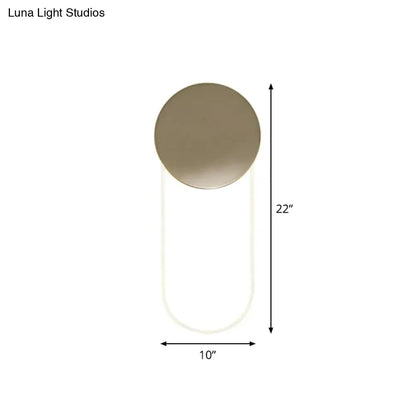 Gold oval LED wall lamp with circular gold backplate and white U-shaped loop on Tampa Home & Garden Store