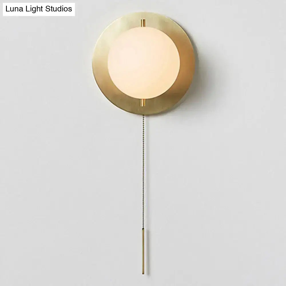 Gold mini globe sconce with brass backplate and frosted white globe Decorbites on Tampa Home & Garden Store