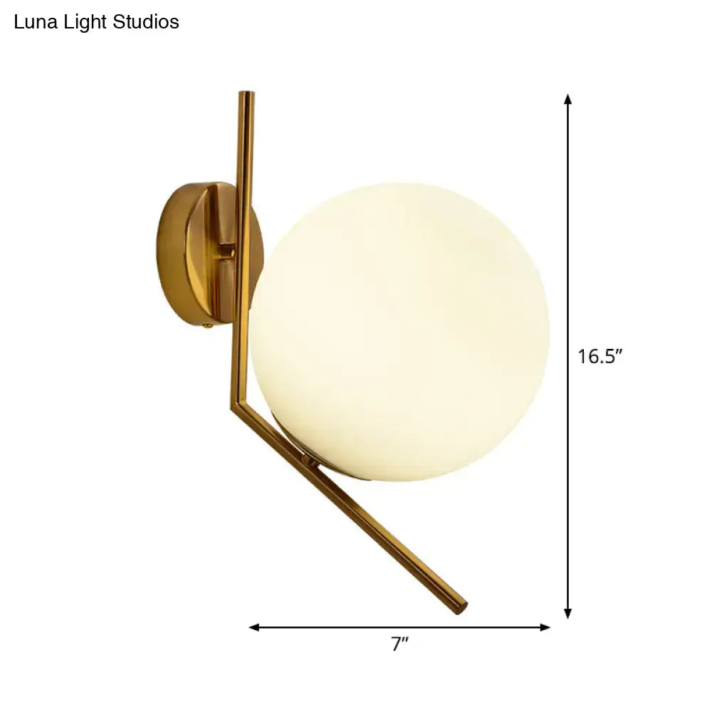 Gold mini globe sconce with frosted glass globe on brass angular wall mount Decorbites on Tampa Home & Garden Store