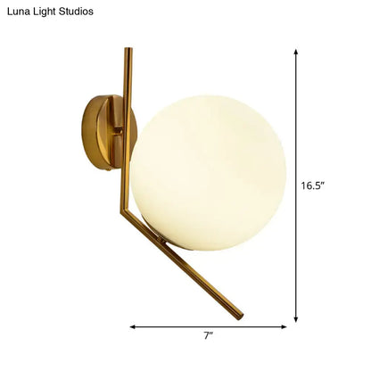 Gold mini globe sconce with frosted glass globe on brass angular wall mount Decorbites on Tampa Home & Garden Store