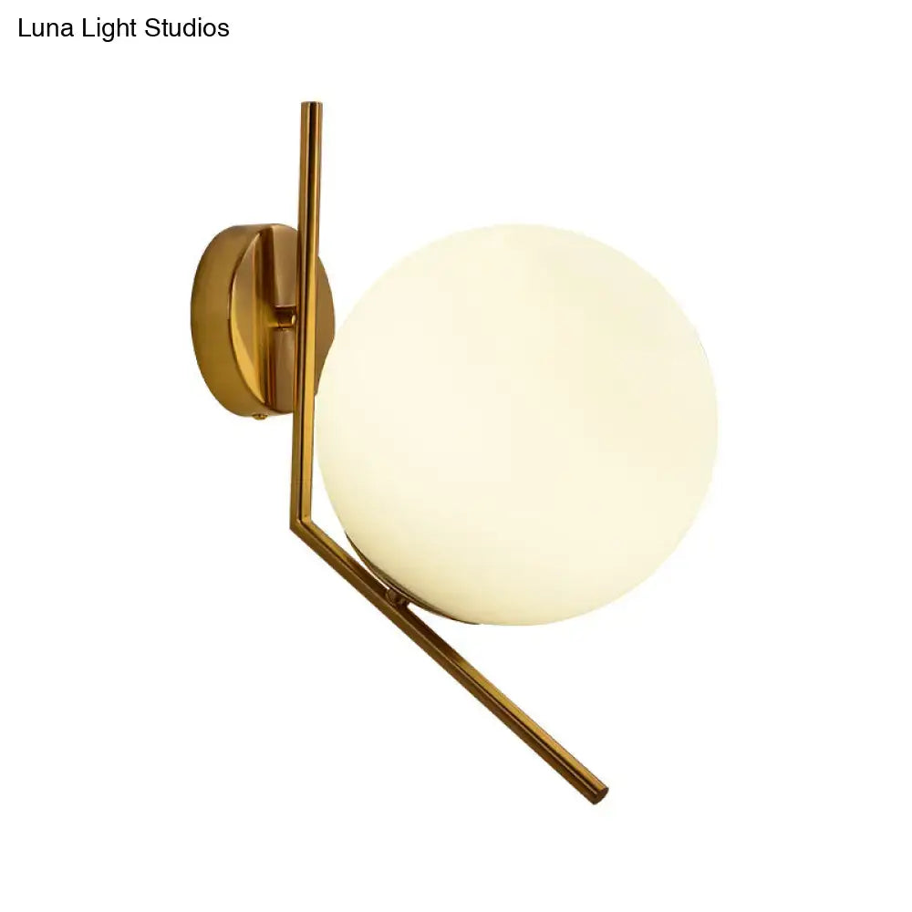 Gold Mini Globe Sconce by Decorbites with frosted glass globe and brass finish on Tampa Home & Garden Store