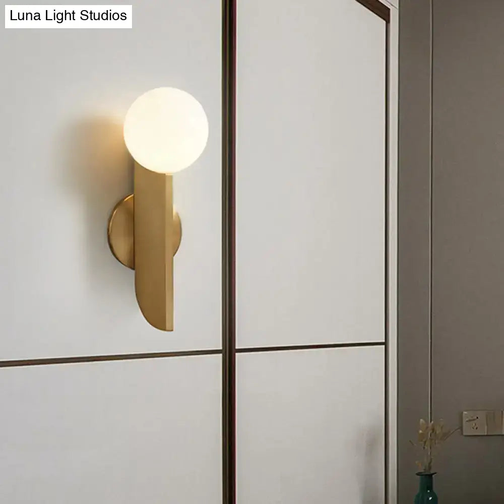 Gold mini globe wall sconce by Decorbites, brass finish with white globe on Tampa Home & Garden Store
