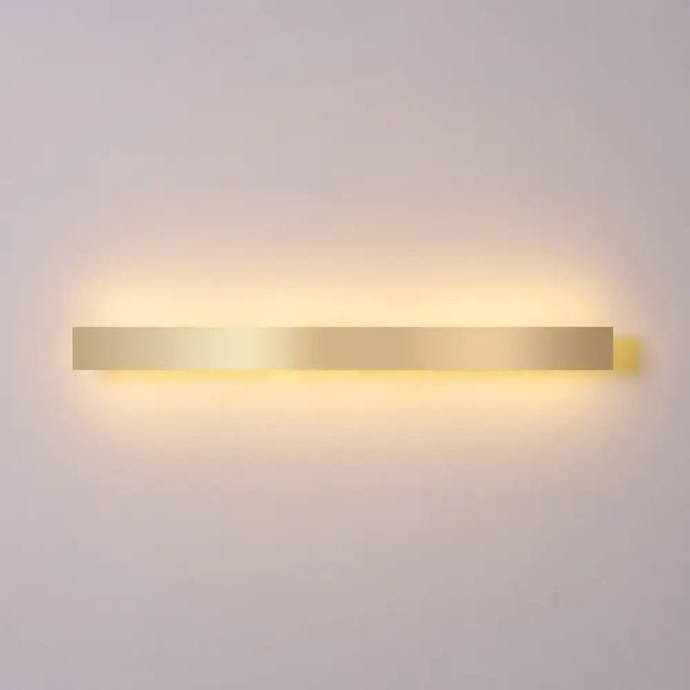 Minimalist gold plated LED wall sconce bar light by Decorbites with warm glow on Tampa Home & Garden Store