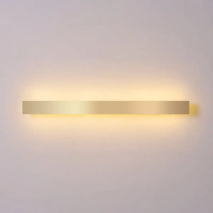 Minimalist gold plated LED wall sconce bar light by Decorbites with warm glow on Tampa Home & Garden Store