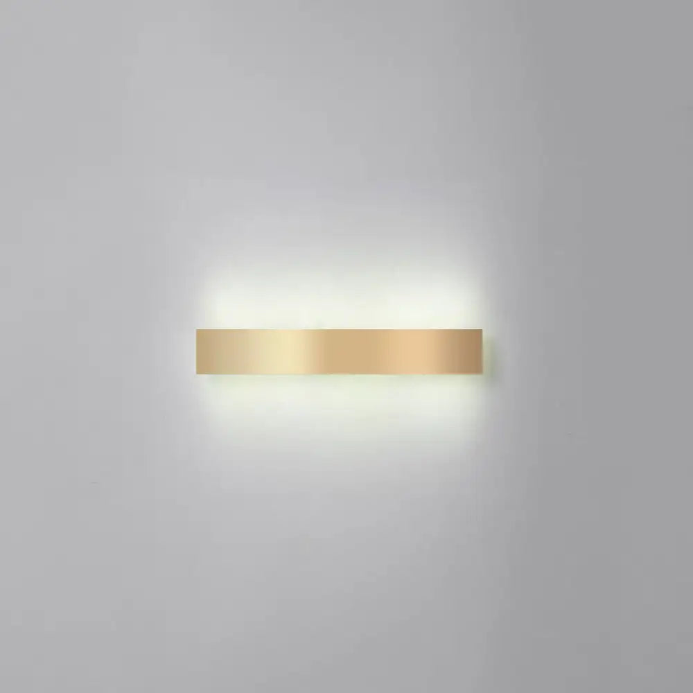 Minimalist gold plated LED wall sconce bar light mounted on wall with warm glow for living rooms on Tampa Home & Garden Store