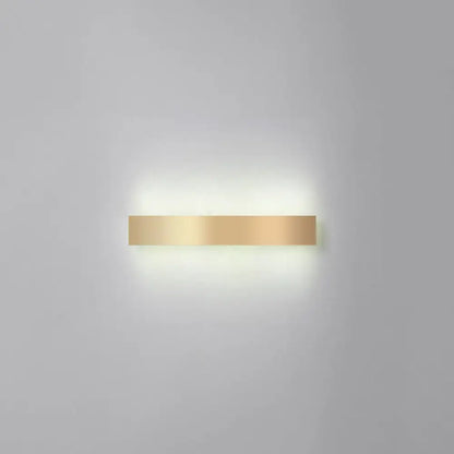 Minimalist gold plated LED wall sconce bar light mounted on wall with warm glow for living rooms on Tampa Home & Garden Store