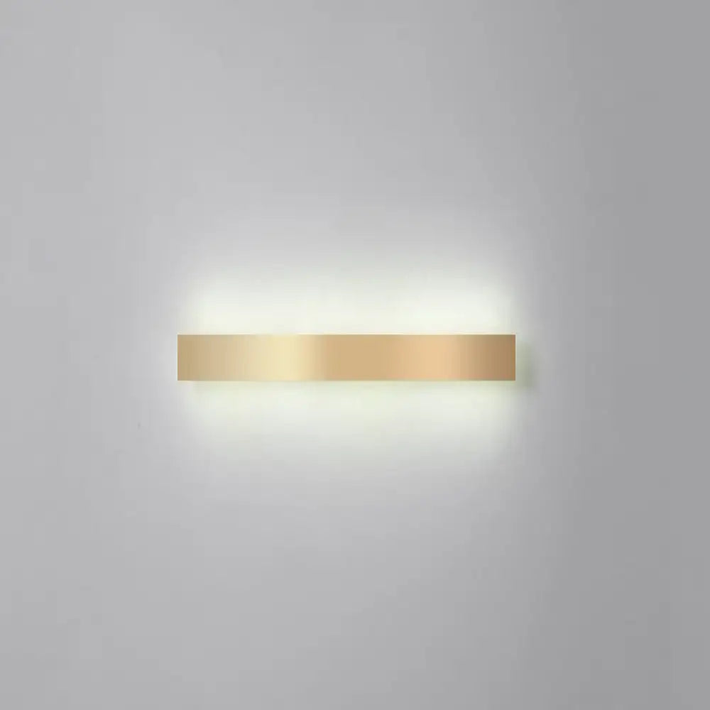 Minimalist gold plated LED wall sconce bar light by Decorbites with warm glow on Tampa Home & Garden Store