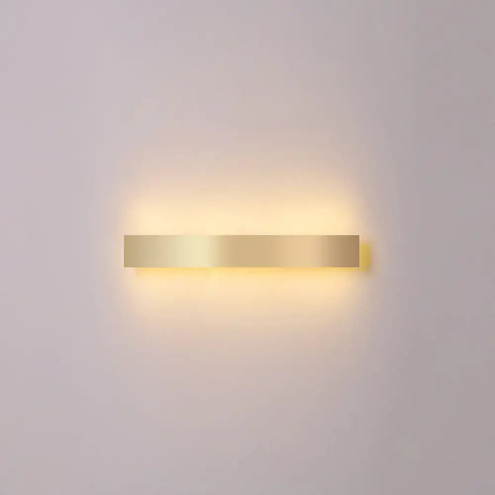 Minimalist gold plated LED wall sconce bar light by Decorbites, warm glow on Tampa Home & Garden Store