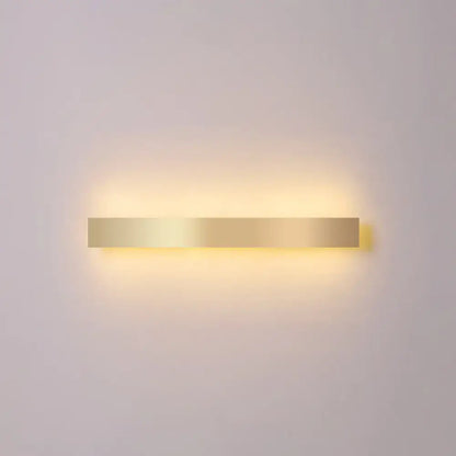 Decorbites gold plated LED wall sconce, minimalist horizontal bar with warm backlit glow on Tampa Home & Garden Store