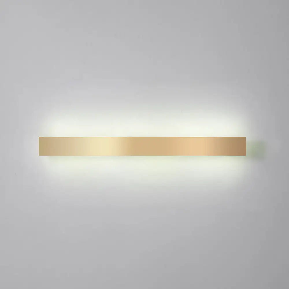 Minimalist gold plated LED wall sconce bar light with warm glow on Tampa Home & Garden Store