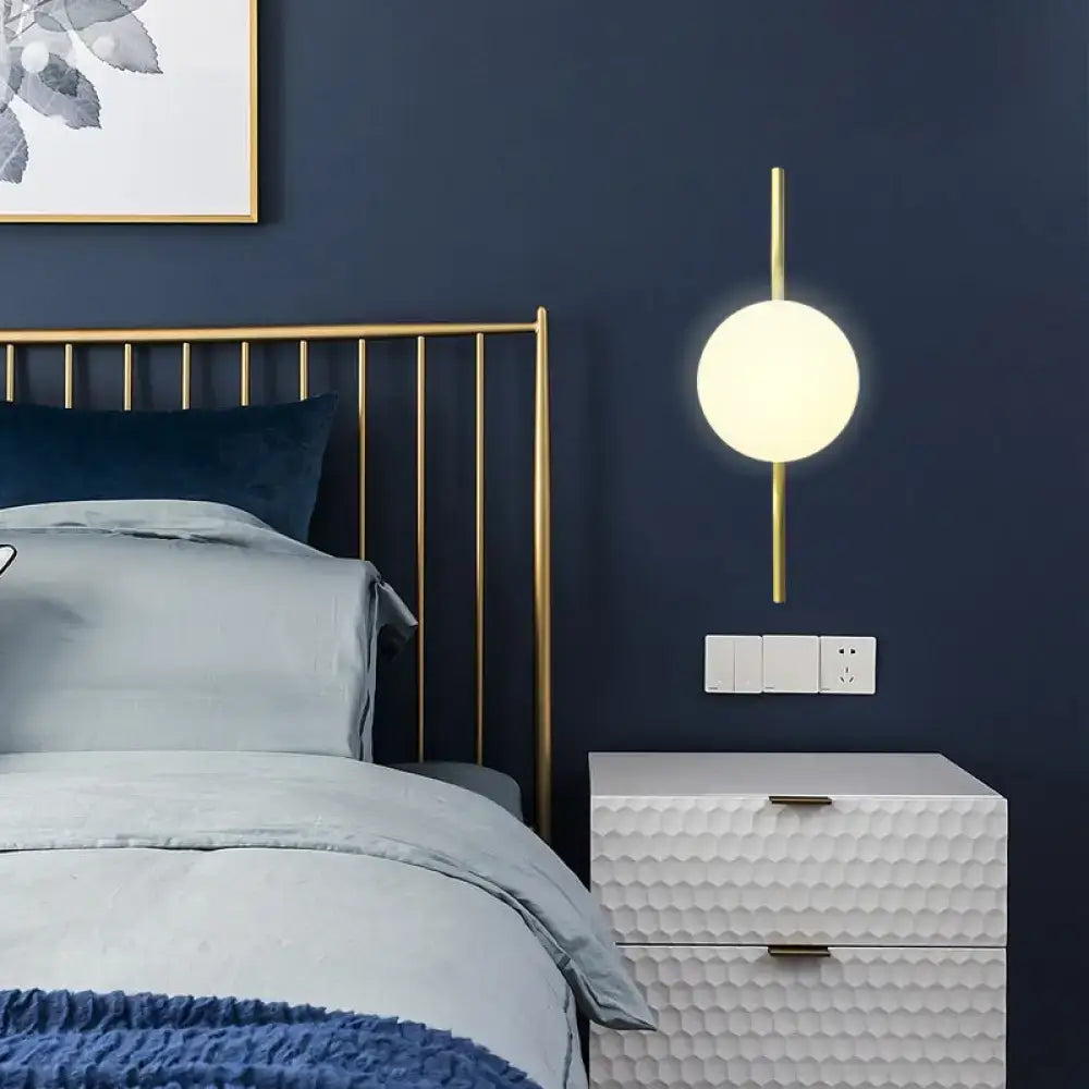 Gold White Globe Sconce with brass arm and glass globe by Decorbites, bedroom wall light on Tampa Home & Garden Store