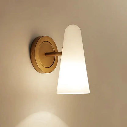Gold frosted glass sconce with brass round backplate and tapered shade by Decorbites on Tampa Home & Garden Store