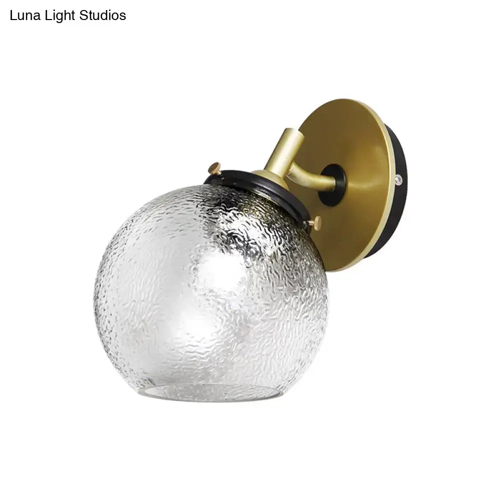 Gold water-glass globe sconce with downward light brass backplate Decorbites on Tampa Home & Garden Store