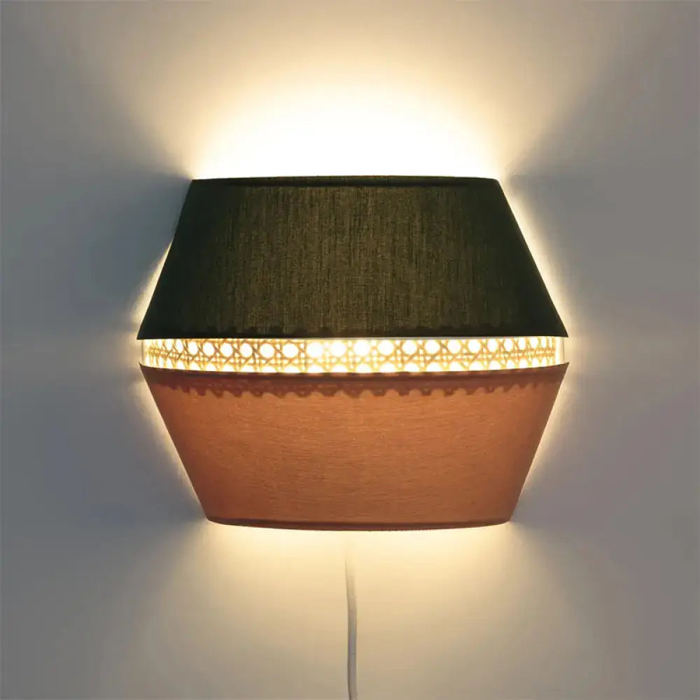 Terracotta rattan wall light by Decorbites with dark top shade and perforated lattice, warm glow on Tampa Home & Garden Store