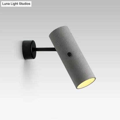 Gray cement wall spotlight by Decorbites with black mounting arm on Tampa Home & Garden Store