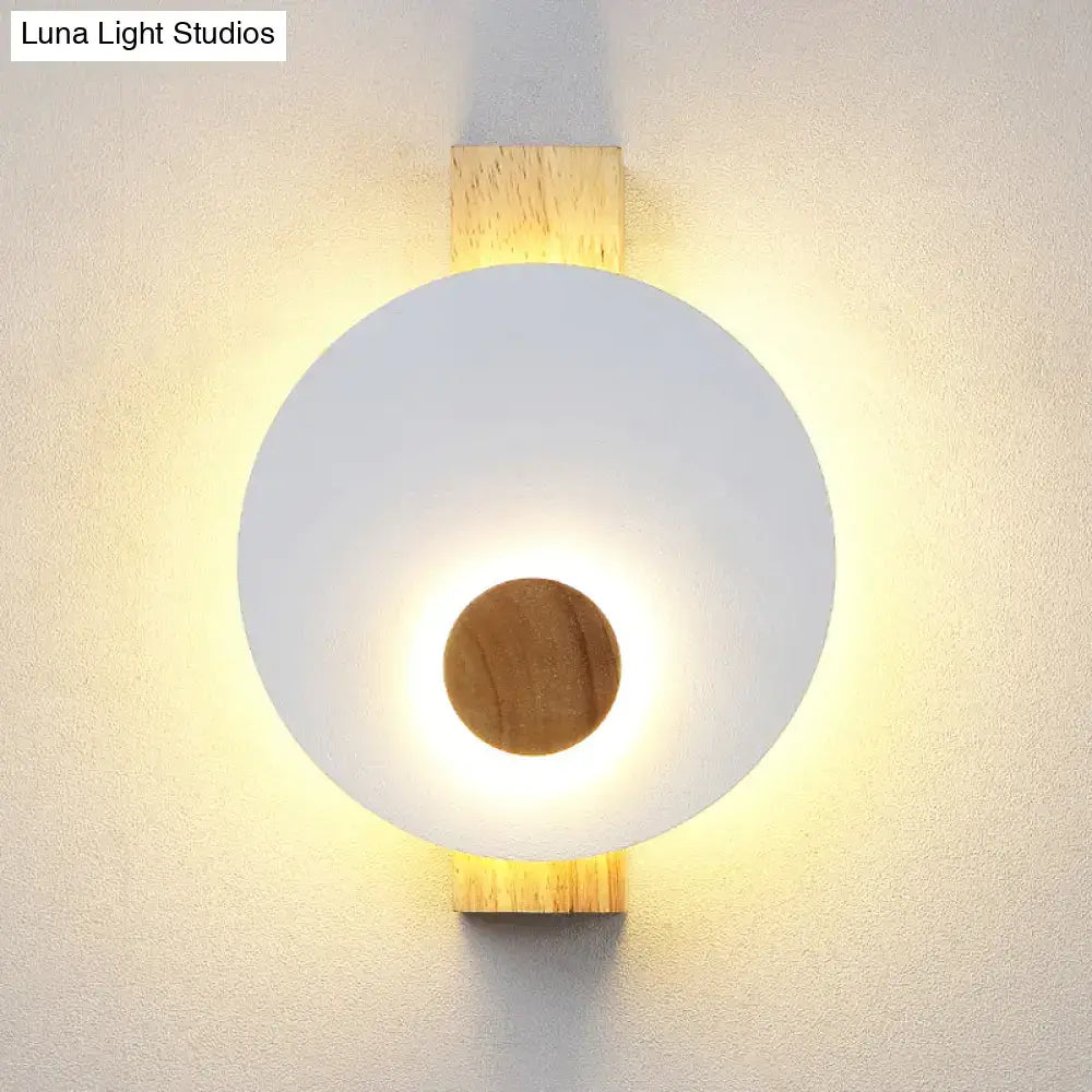 Gray metal disk sconce with frosted white circular shade and wood accent by Decorbites on Tampa Home & Garden Store