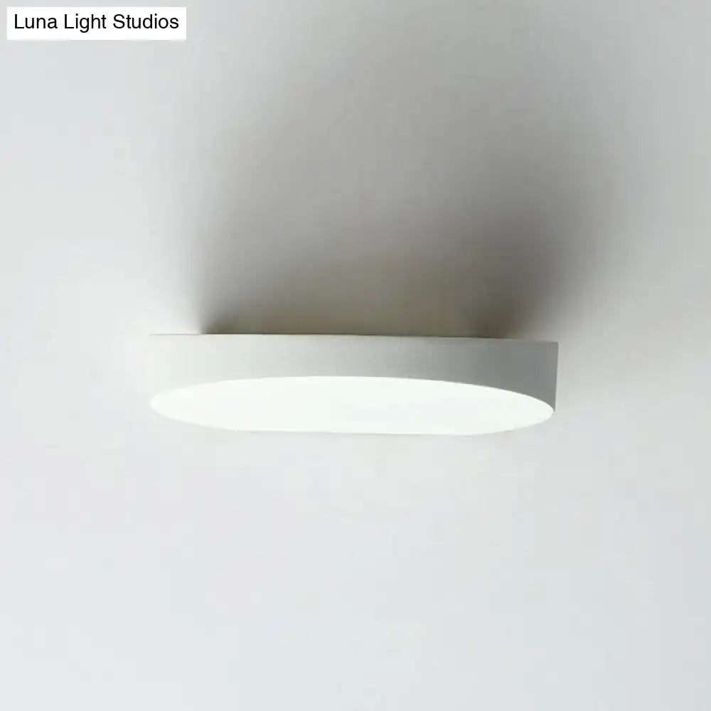 Grey aluminum minimalist corridor sconce with circular white diffuser, wall-mounted on Tampa Home & Garden Store