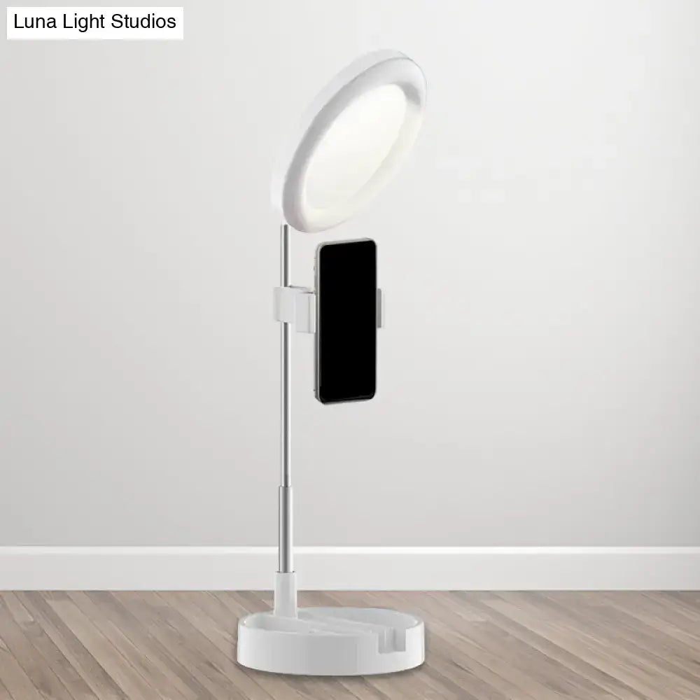 Black metal ring light with phone holder on adjustable stand by Decorbites on Tampa Home & Garden Store