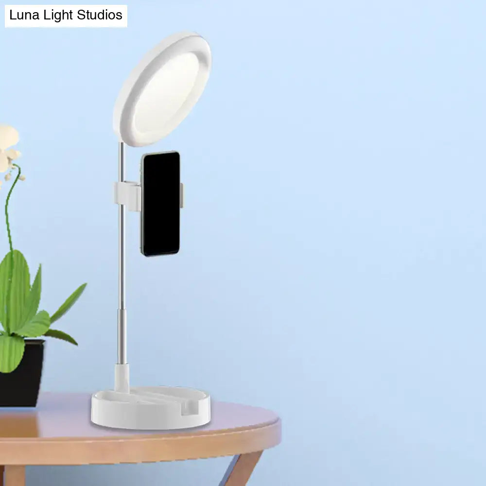 Black Metal Ring Light with phone mount on adjustable chrome stand and white base on Tampa Home & Garden Store