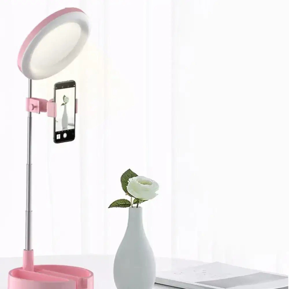 Black metal ring light with pink phone clamp on adjustable silver stand on Tampa Home & Garden Store