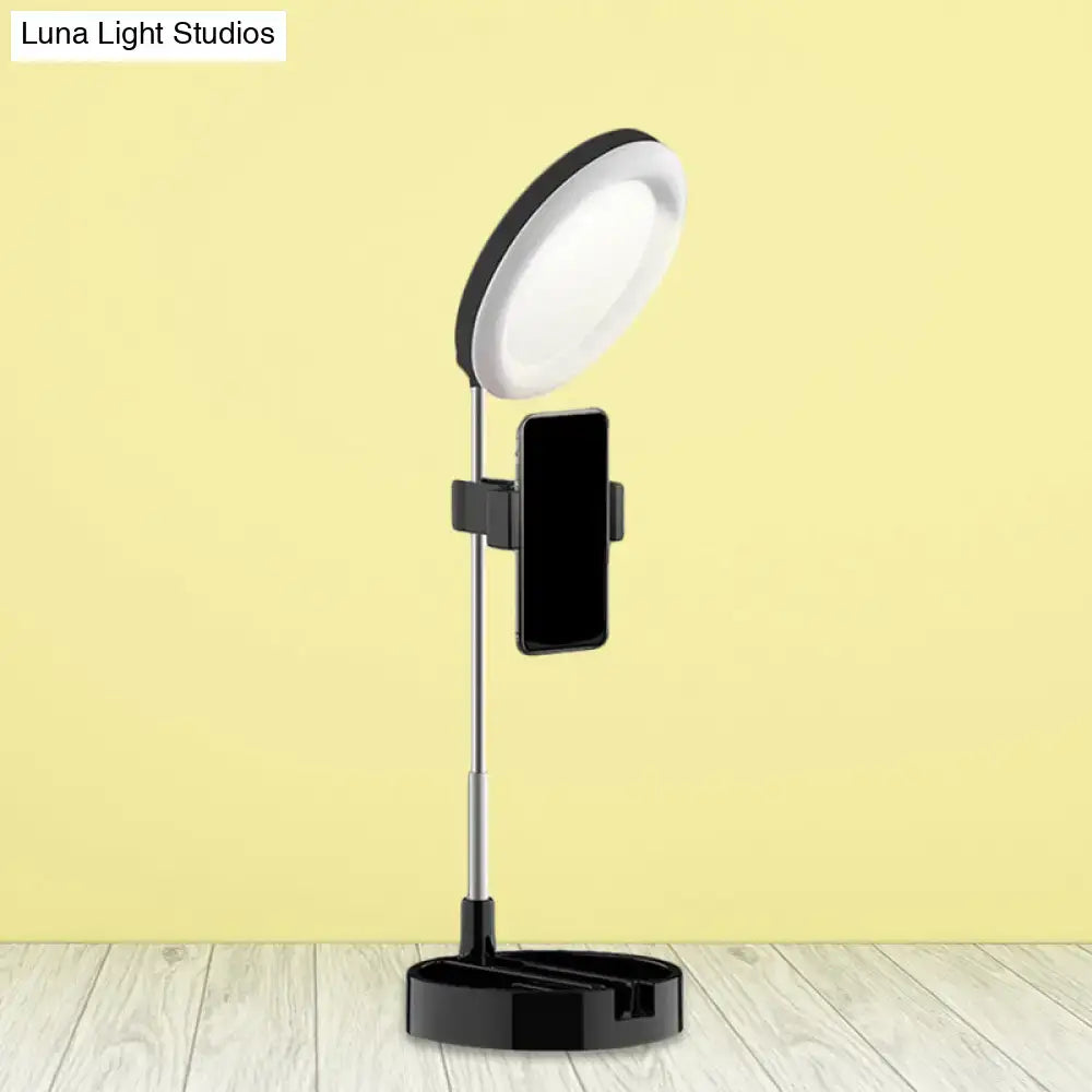 Decorbites black metal ring light with phone holder on an adjustable tripod stand on Tampa Home & Garden Store