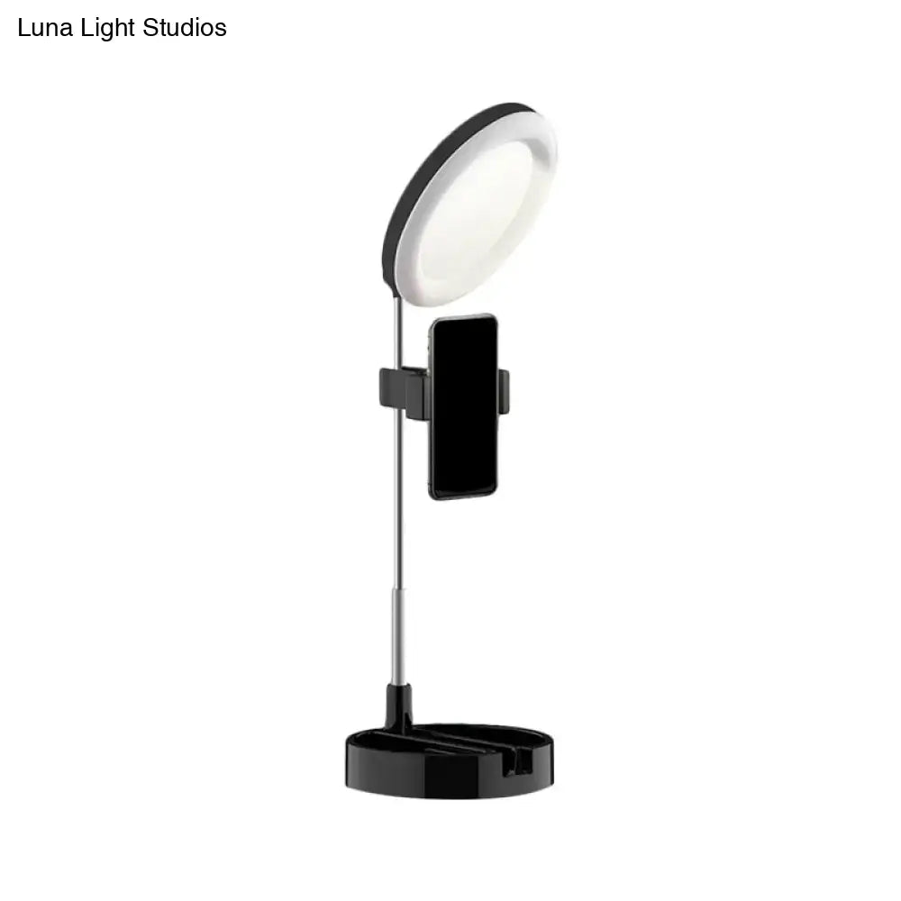 Black metal ring light with phone holder on adjustable stand by Decorbites on Tampa Home & Garden Store