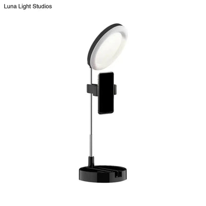 Black metal ring light with phone holder on adjustable stand by Decorbites on Tampa Home & Garden Store