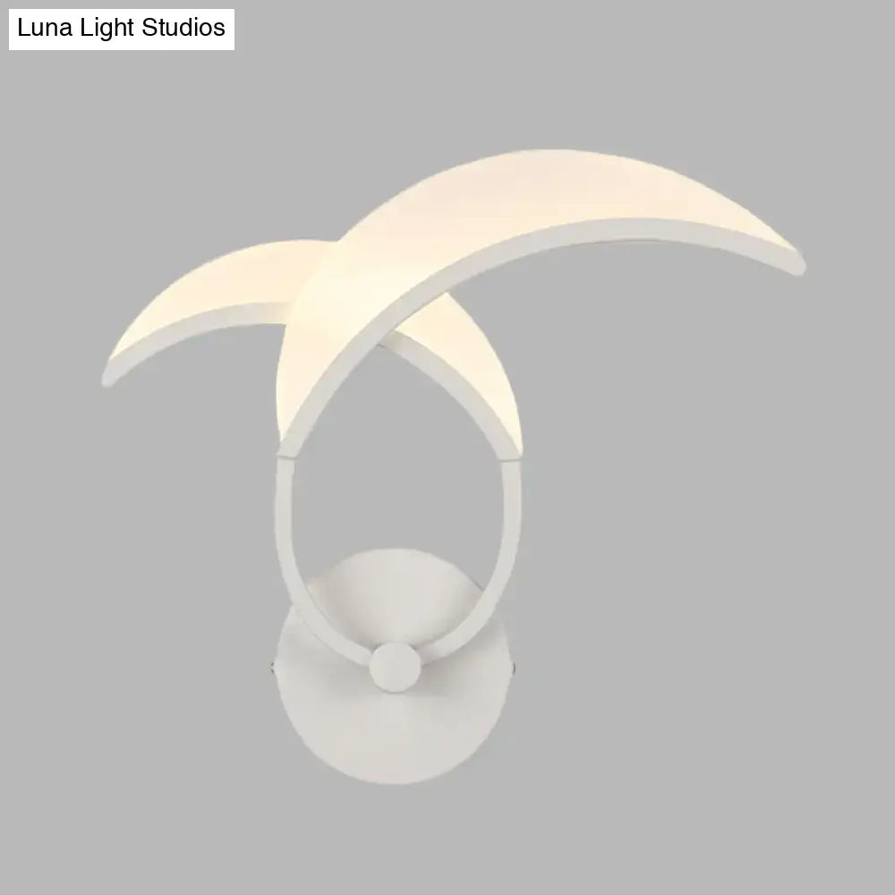 White curved wall sconce by Decorbites with overlapping crescent arms and round base on Tampa Home & Garden Store