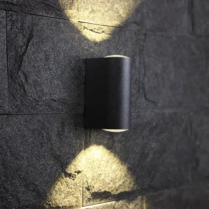 Minimalist matte black tube outdoor wall light sconce by Decorbites on Tampa Home & Garden Store