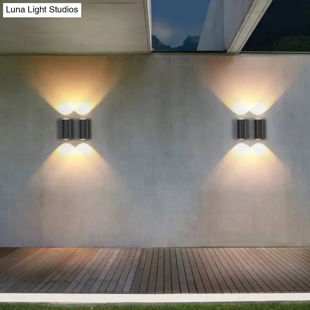 Matte black tube outdoor wall light sconce by Decorbites, dual units with warm up/down glow on Tampa Home & Garden Store