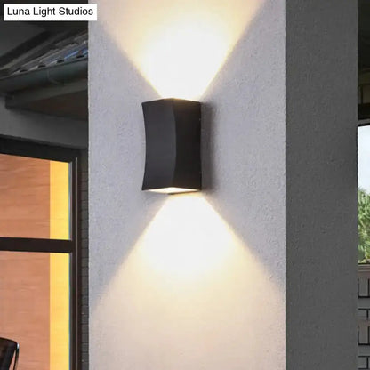 Minimalist black curved metal wall sconce by Decorbites, living room lighting on Tampa Home & Garden Store