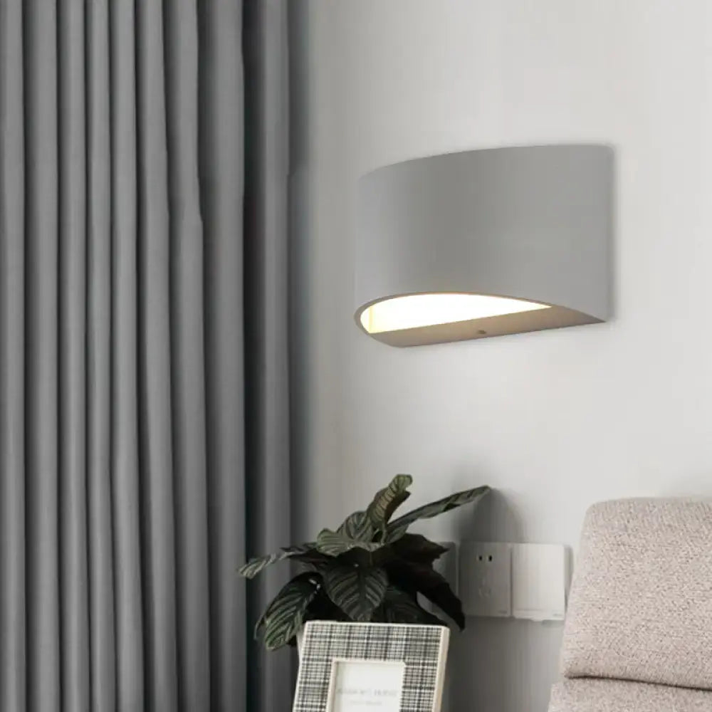 Curved Metal Wall Sconce by Decorbites, gray metal finish, modern indoor lighting on Tampa Home & Garden Store