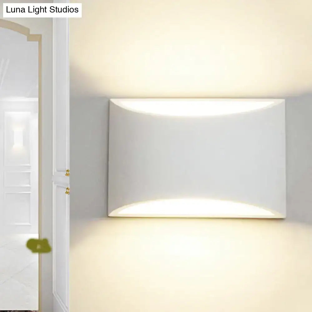 Curved Metal Wall Sconce, white finish by Decorbites; ambient uplight and downlight on Tampa Home & Garden Store