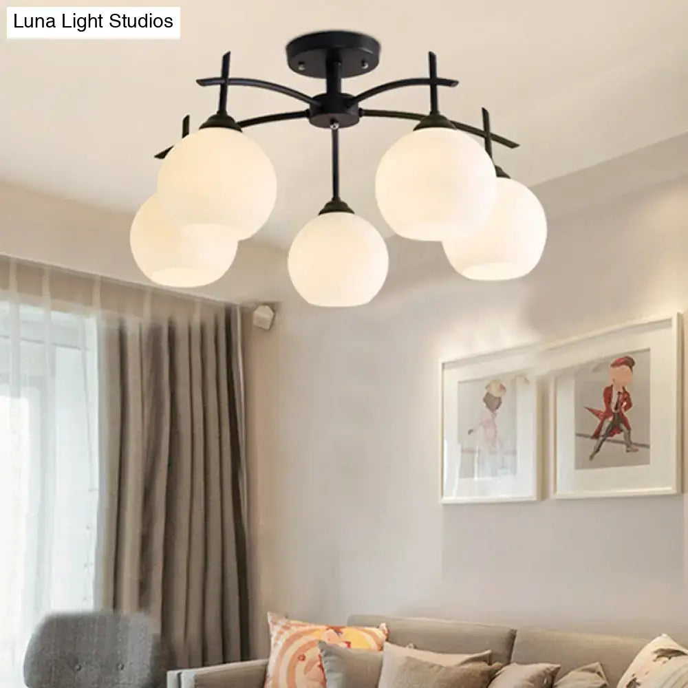 Opal glass black chandelier with five frosted globes and metal frame by Decorbites on Tampa Home & Garden Store