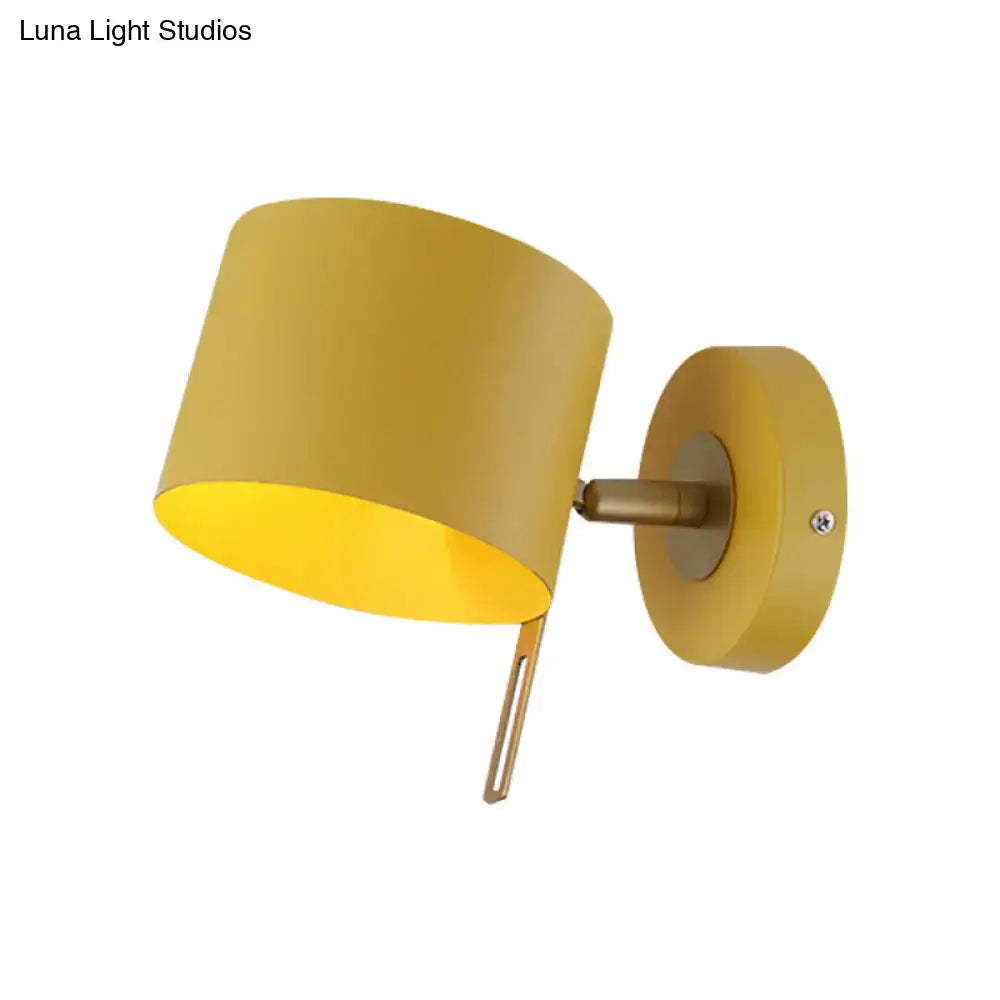 Pink brass cylinder sconce with brass arm and round backplate by Decorbites on Tampa Home & Garden Store
