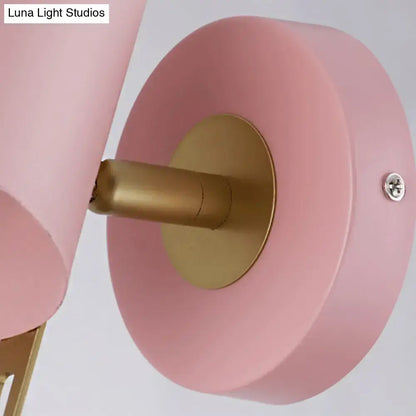 Pink brass cylinder sconce with round pink backplate and brass wall mount by Decorbites on Tampa Home & Garden Store