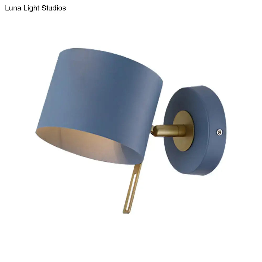 Pink Brass Cylinder Sconce with blue lampshade and brass arm on Tampa Home & Garden Store