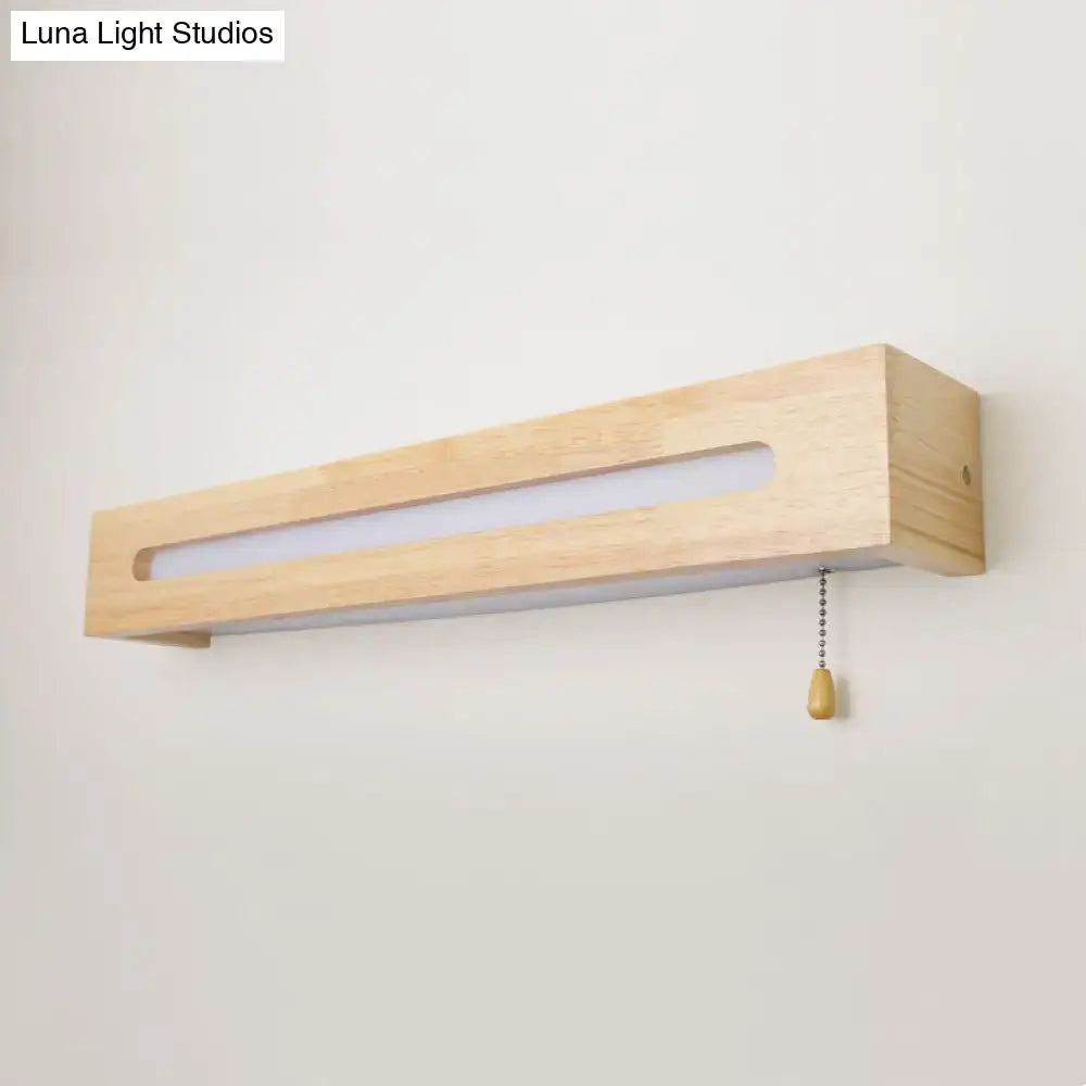 Wood wall sconce light in natural pine with long frame and frosted insert, pull chain on Tampa Home & Garden Store