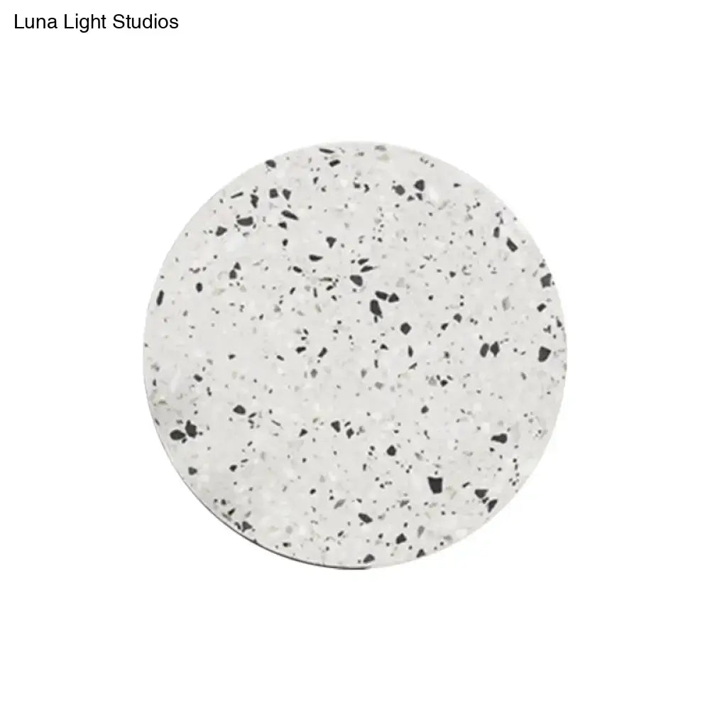 Minimalist terrazzo round LED wall sconce with speckled white-gray surface on Tampa Home & Garden Store