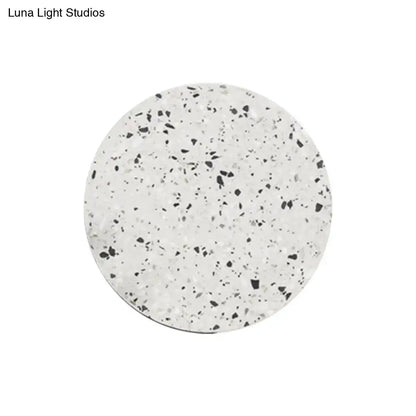 Minimalist terrazzo round LED wall sconce with speckled white-gray surface on Tampa Home & Garden Store