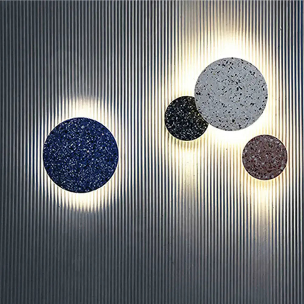 Terrazzo round LED wall sconce with five discs on a ribbed wall on Tampa Home & Garden Store