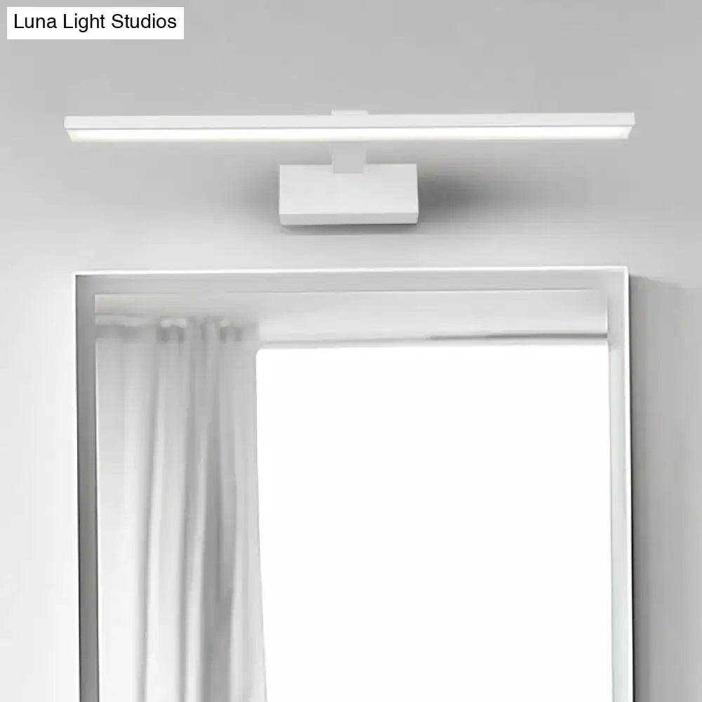 White acrylic vanity light by Decorbites mounted above a bathroom mirror on Tampa Home & Garden Store