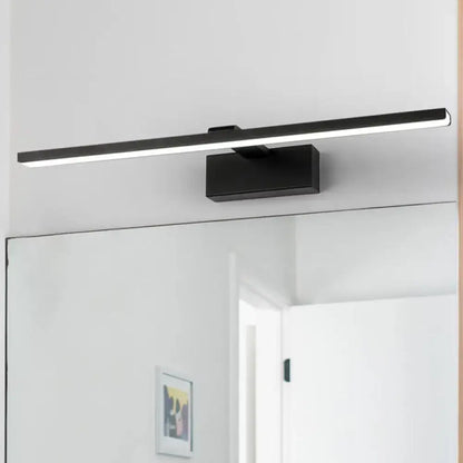 White acrylic vanity light bar with black mount above a bathroom mirror Decorbites on Tampa Home & Garden Store
