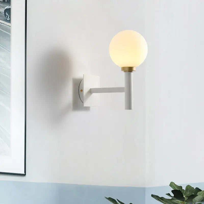 Decorbites White Brass Opal Wall Lamp with frosted globe, wall mount backplate and arm on Tampa Home & Garden Store