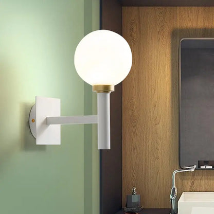 White Brass Opal Wall Lamp with a frosted globe, white arm and brass accent Decorbites on Tampa Home & Garden Store