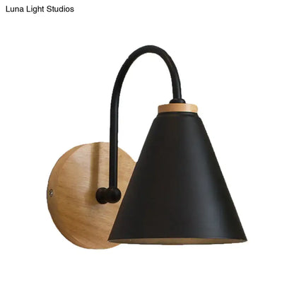 Black metal conical gooseneck wall sconce with wooden backplate on Tampa Home & Garden Store