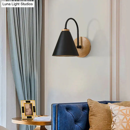 Black conical gooseneck wall sconce by Decorbites, black metal shade with wooden backplate on Tampa Home & Garden Store
