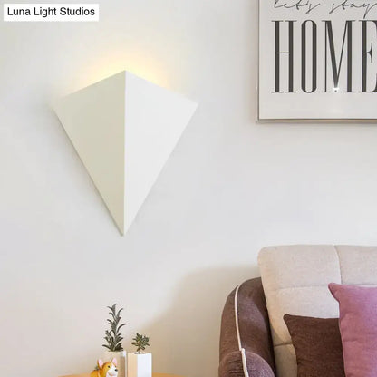 White cone wall lamp by Decorbites; modern geometric wall sconce with warm glow on Tampa Home & Garden Store