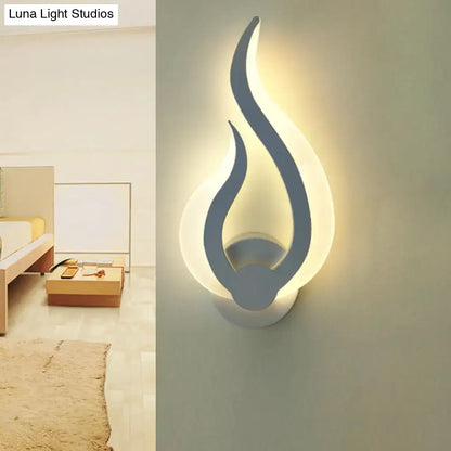 White acrylic flame sconce wall light by Decorbites with warm LED glow on Tampa Home & Garden Store